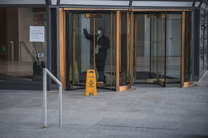 Man cleaning the entrace / exit doors